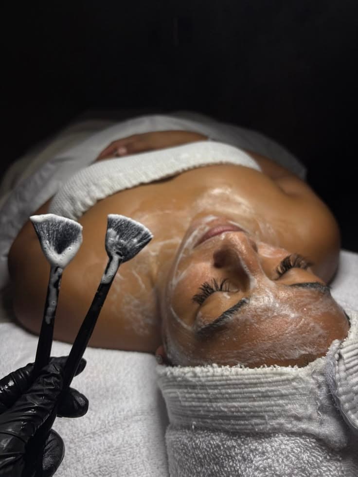 Facial mask applied with fan brushes.