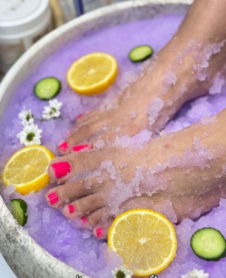 Feet resting in lavender jelly with citrus and cucumber.